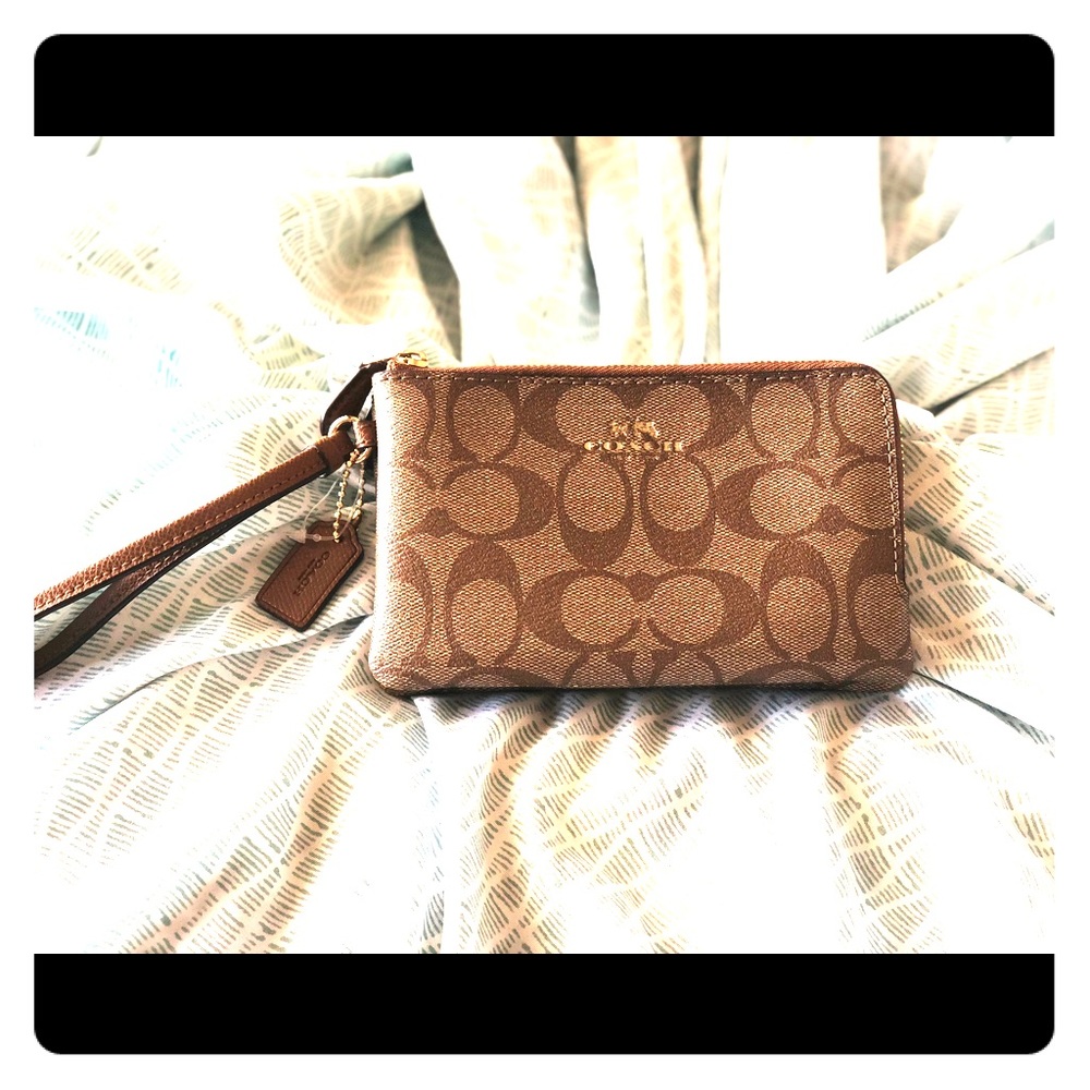 Like new authentic Coach wristlet .
